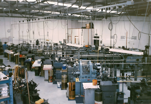 A bustling factory filled with numerous machines operating efficiently in a well-organized industrial environment.